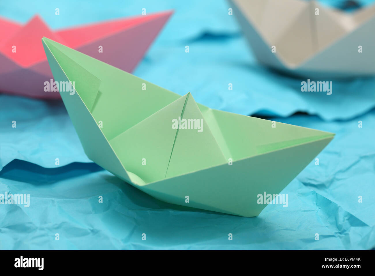Paper boats in the paper ocean Stock Photo