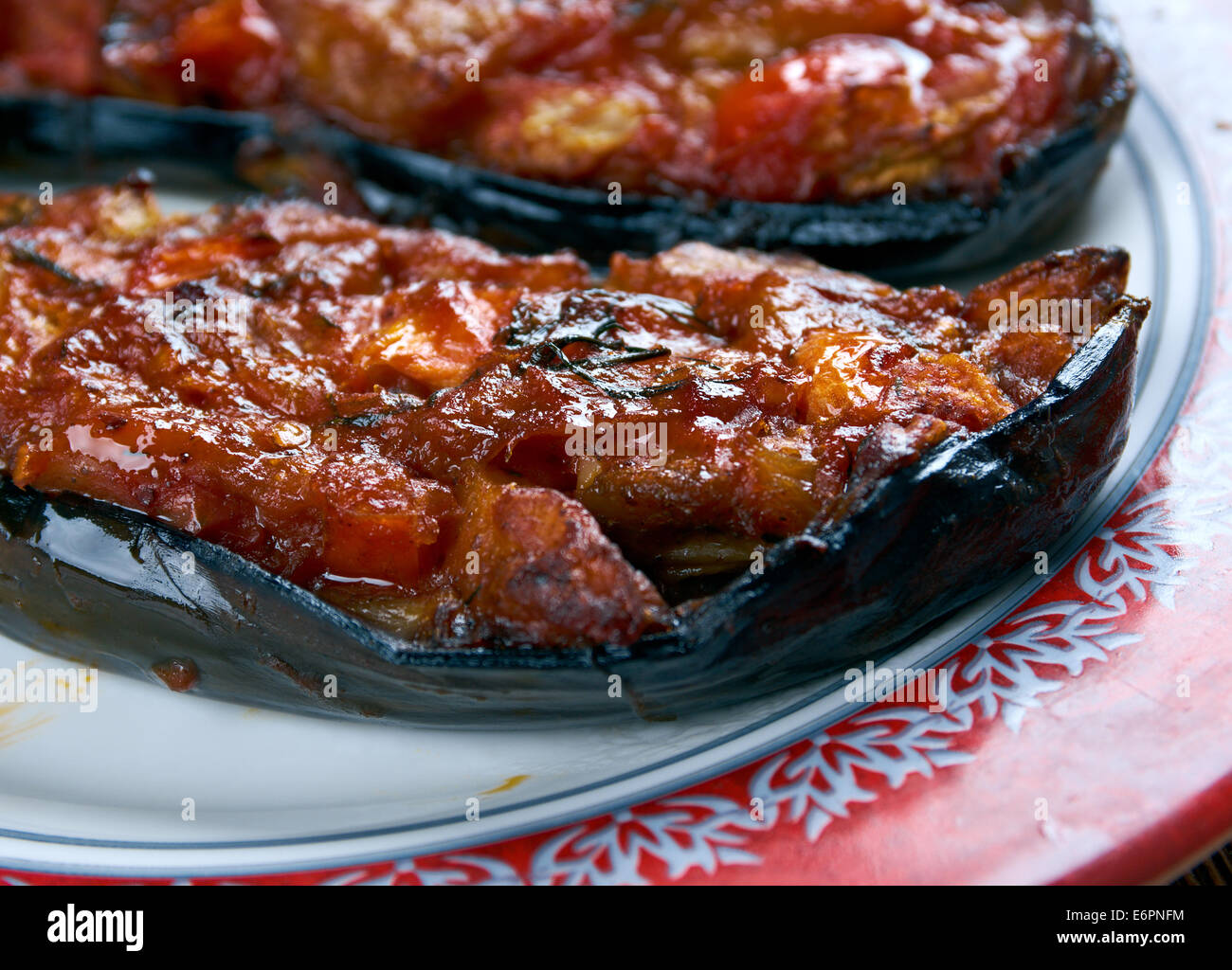 Imam bayildi - dishes found in Turkish cuisine.whole braised eggplant stuffed with onion, garlic and tomatoes, Stock Photo