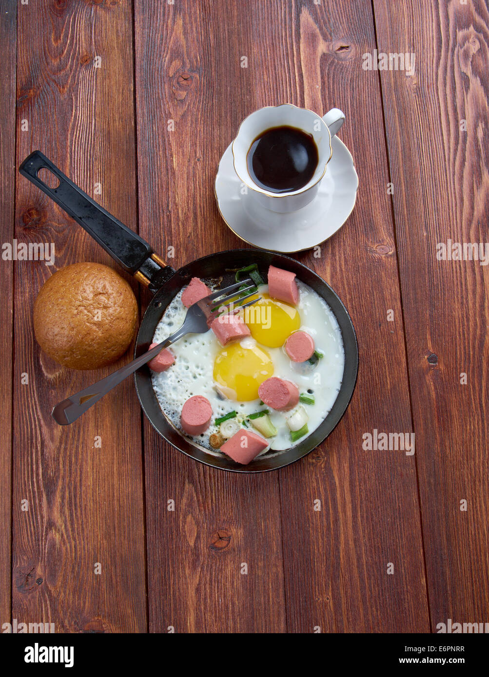 fried eggs with  sausages and a cup of coffee .breakfast bachelor Stock Photo