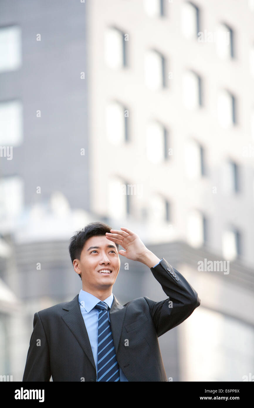 Man shielding eyes hand raised hi-res stock photography and images - Alamy