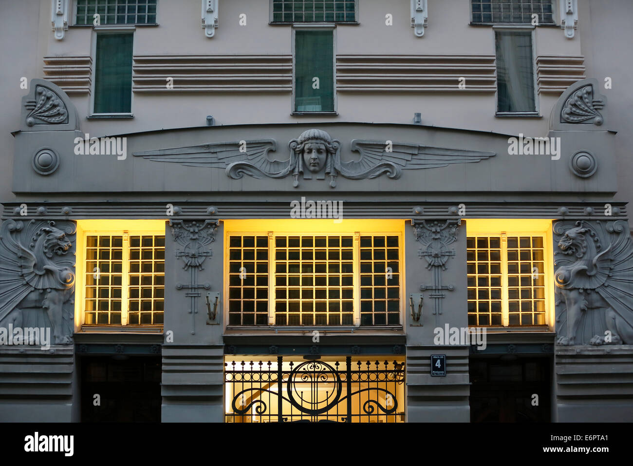 Sculpture, allegory of the sun and winged lion above the entrance, Art Nouveau facade of the house Alberta iela 4 or Albert Stock Photo