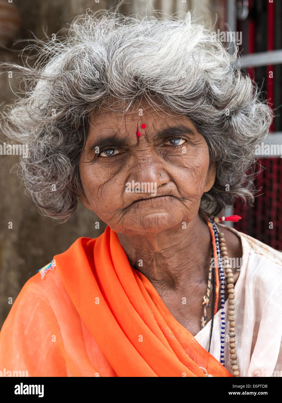 Portrait of Indian Hindu woman in colorful orange sari Stock Photo