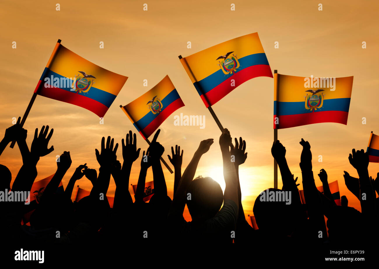 Silhouettes of People Holding Flag of Ecuador Stock Photo