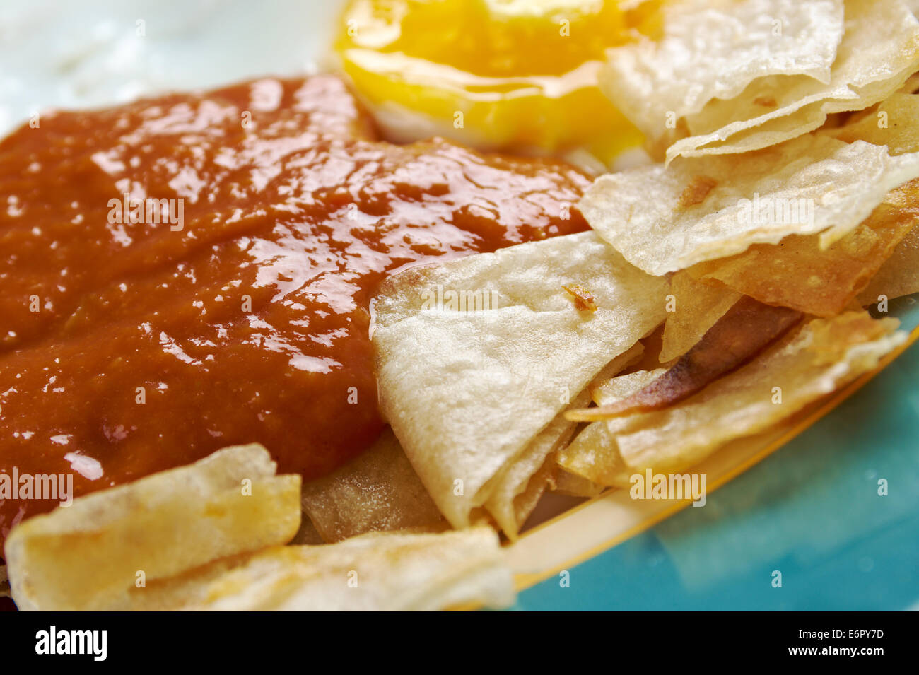 Huevos con chilaquiles Mexican traditional breakfast eggs. Eggs with