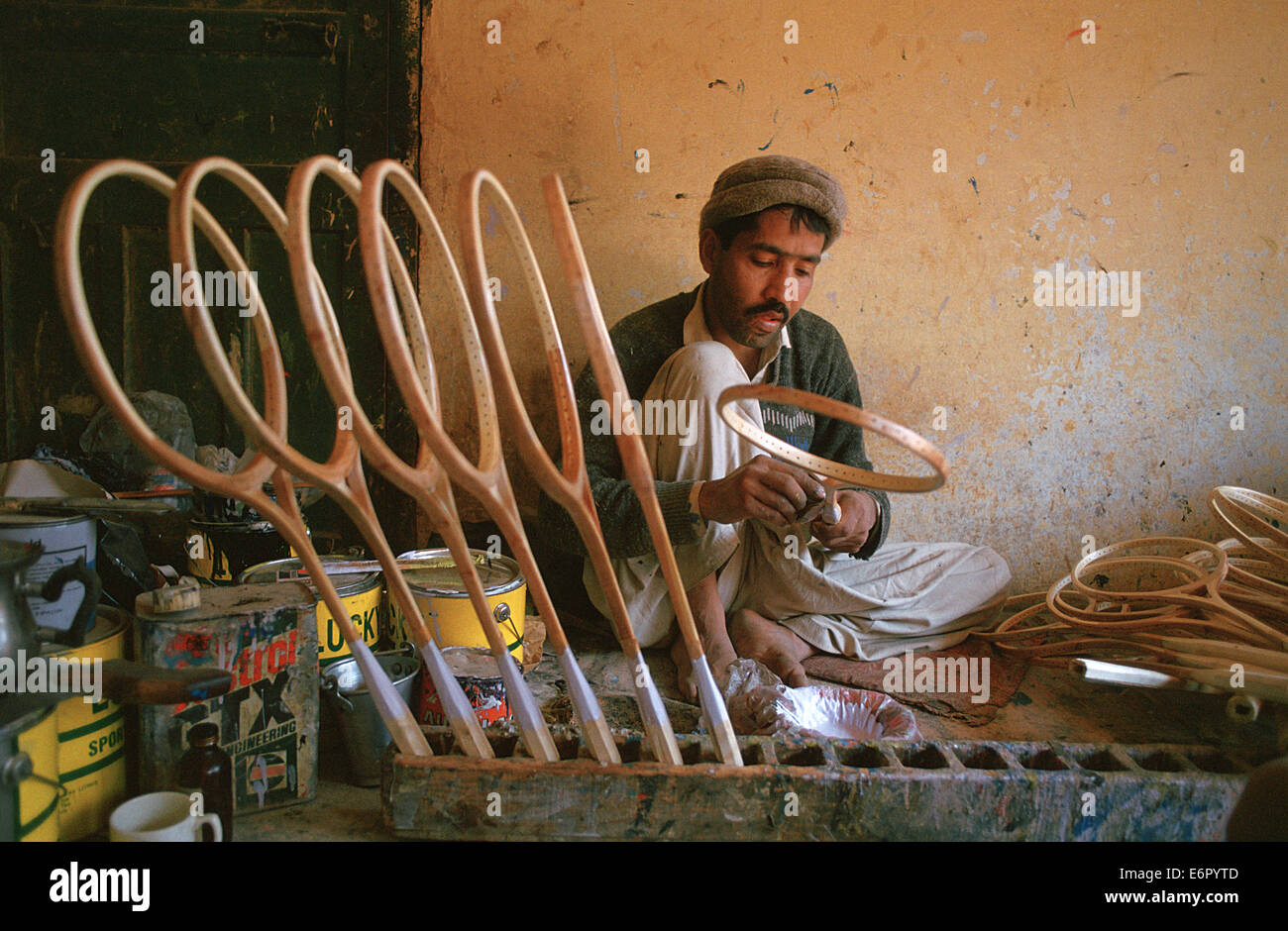 Man making tennis rackets ( Pakistan Stock Photo Alamy