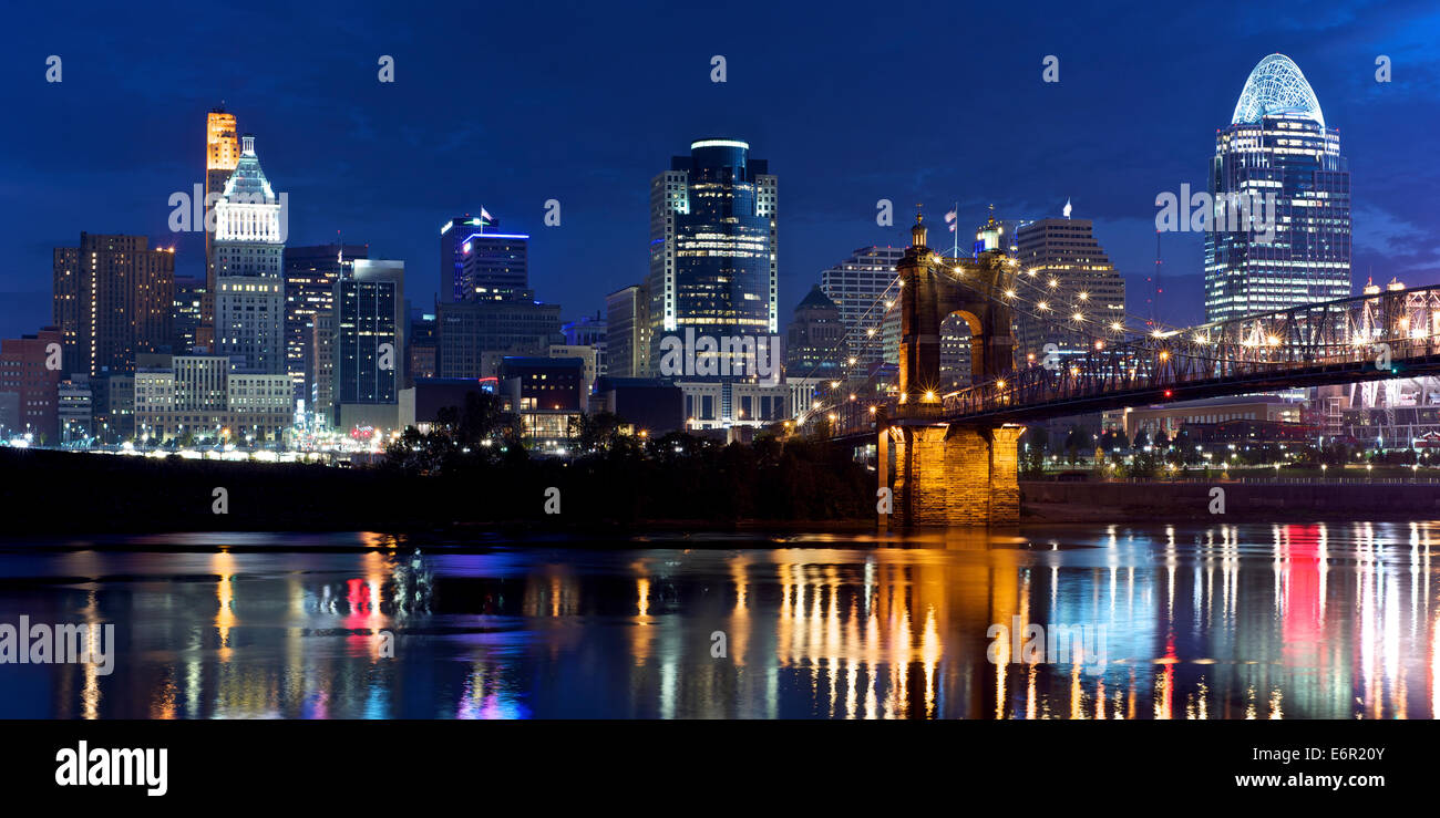 Dawn over the business district of Cincinnati with reflections from the building lights in  the River Ohio Stock Photo