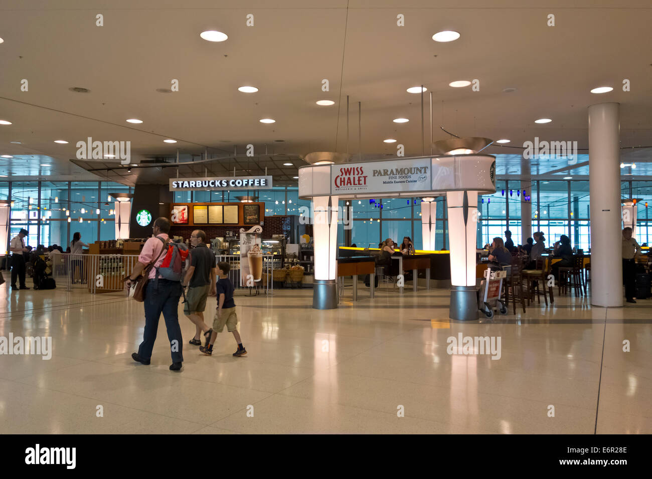 Restaurants and dining at Toronto Pearson International Airport.  Swiss Chalet and Starbucks in the airport terminal 1. Stock Photo