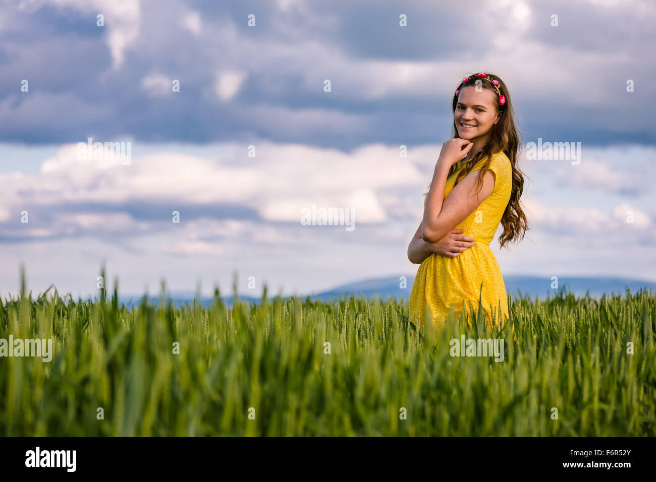 A young woman in a wheat field Stock Photo - Alamy