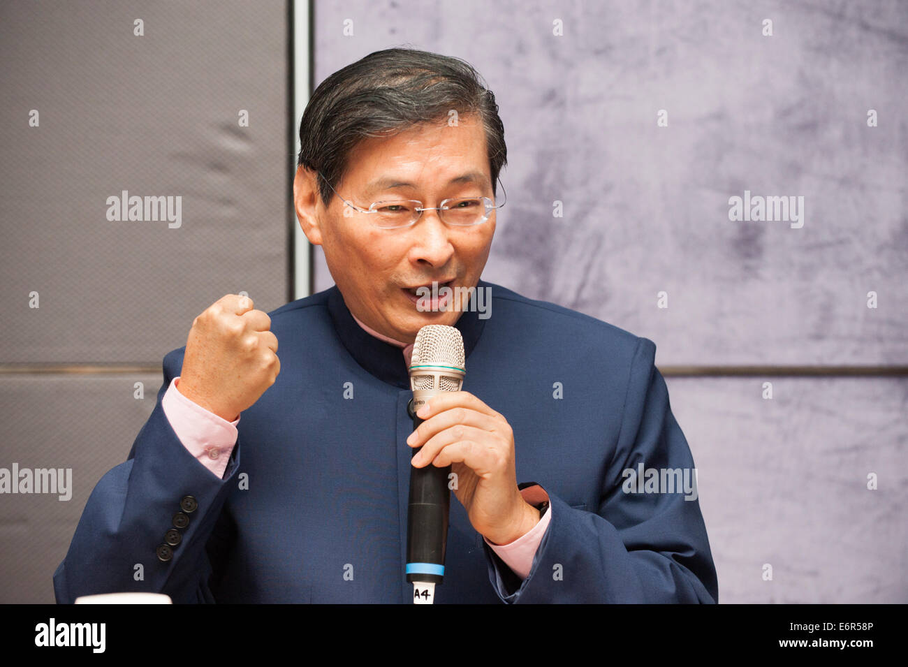 Taipei. 29th Aug, 2014. Mr. Chang An-lo, AKA “White Wolf”, leader and President of Taiwan’s political China Unification Promotion Party (Unionist Party), addresses the Taiwan Foreign Correspondents’ Club (FCC), Taipei, Taiwan, Friday, August 29, 2014.   He and his political party advocate the “peaceful unification of China and ‘one country, two systems’”.  Wanted in Taiwan since the mid-1990s, Mr. Chang An-lo returned to Taiwan in 2013 to promote unification with China as 'one country, two systems.' Credit:  Henry Westheim Photography/Alamy Live News Stock Photo