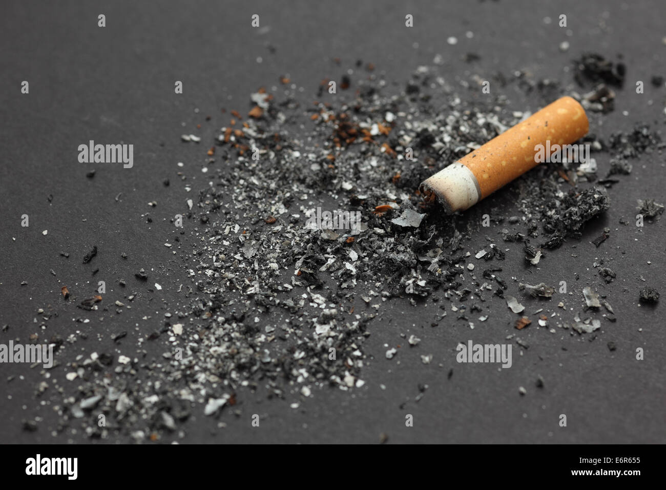 Cigarette butt with ash on black background Stock Photo