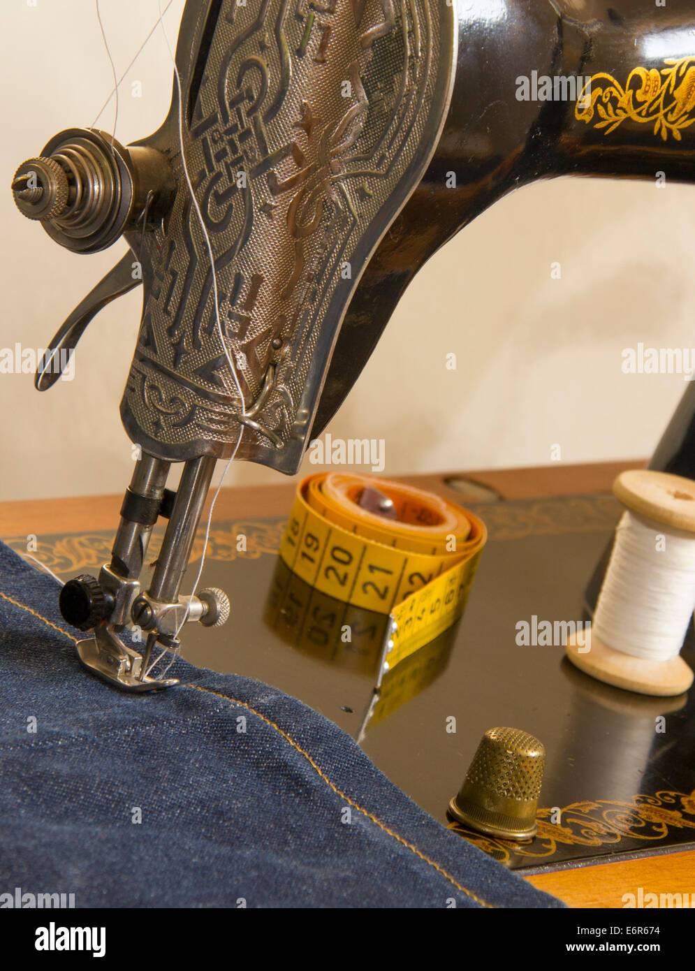 Close up sewing machine jeans factory hires stock photography and