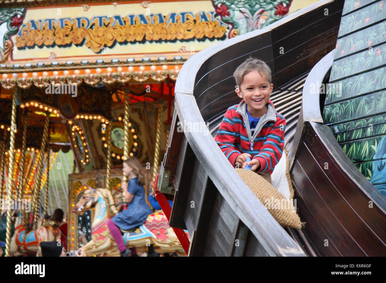 Peak District, Derbyshire, UK. 29 August 2014. The helter skelter proves a draw for those attending the Chatsworth Country Fair held in parkland surrounding the Derbyshire stately home.  Credit:  Matthew Taylor/Alamy Live News Stock Photo