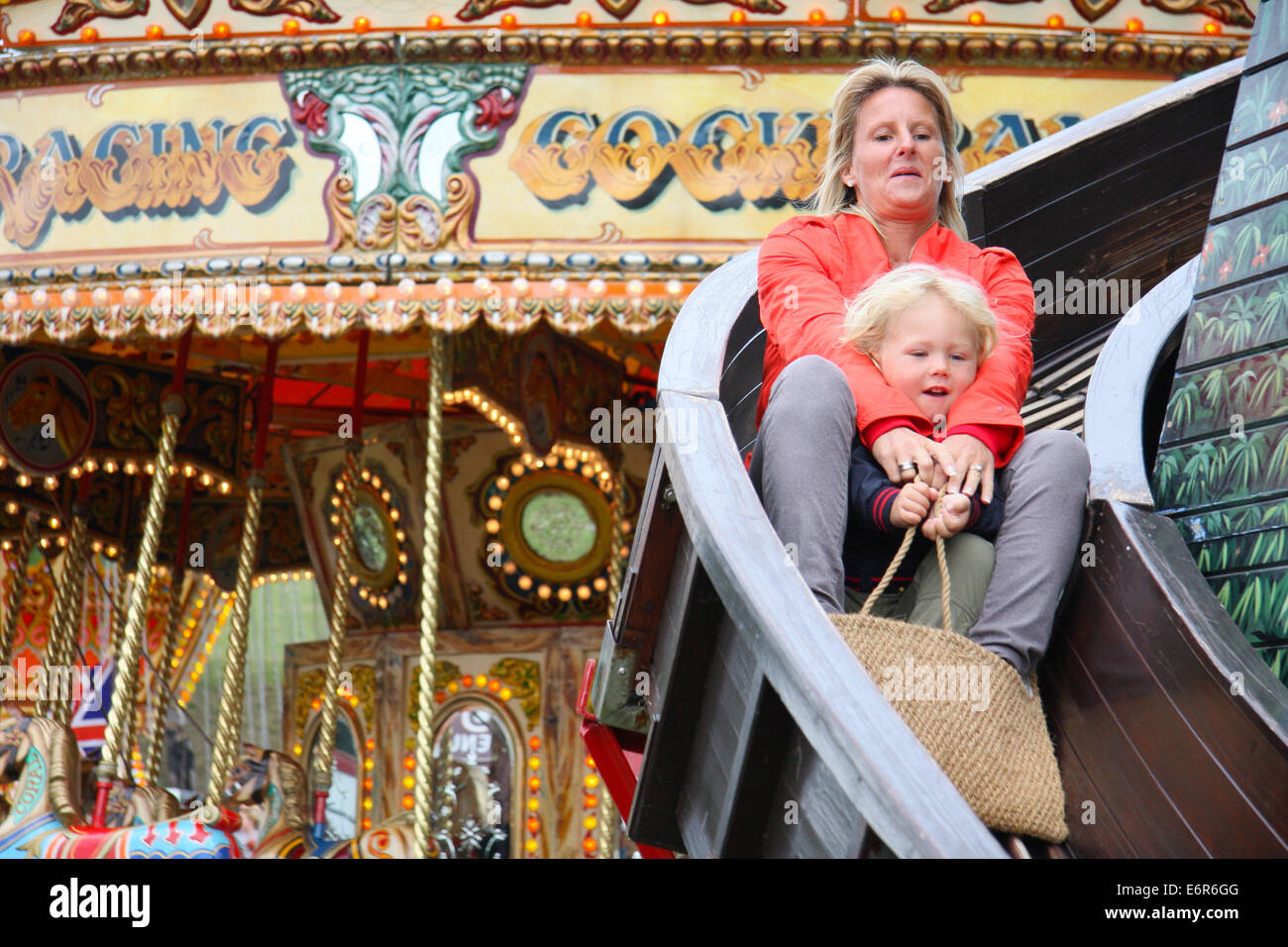 Peak District, Derbyshire, UK. 29 August 2014. The helter skelter proves a draw for those attending the Chatsworth Country Fair held in parkland surrounding the Derbyshire stately home.  T Credit:  Matthew Taylor/Alamy Live News Stock Photo