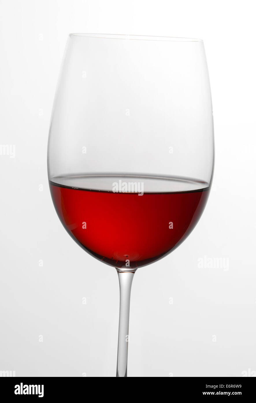 Single glass half full of red wine Stock Photo Alamy