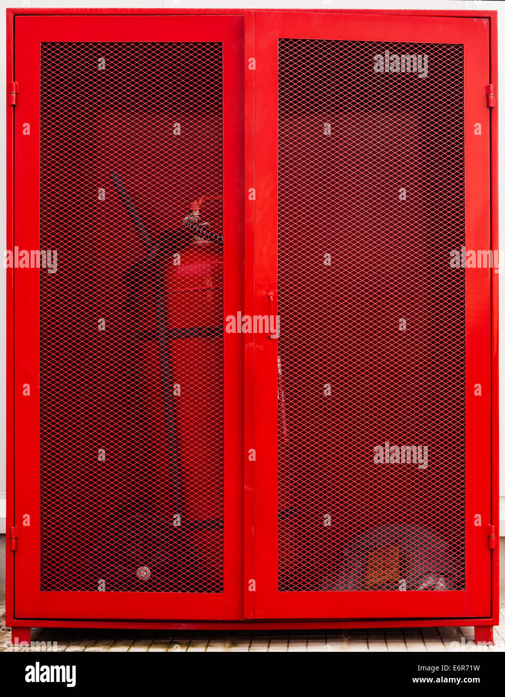 Fire fighter equipment in the red box with extinguisher Stock Photo Alamy