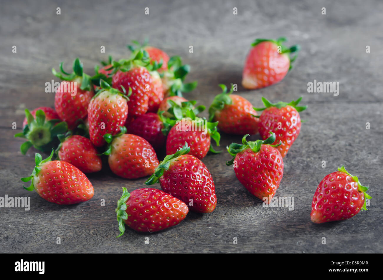 still life fresh strawberries over wooden background Stock Photo - Alamy