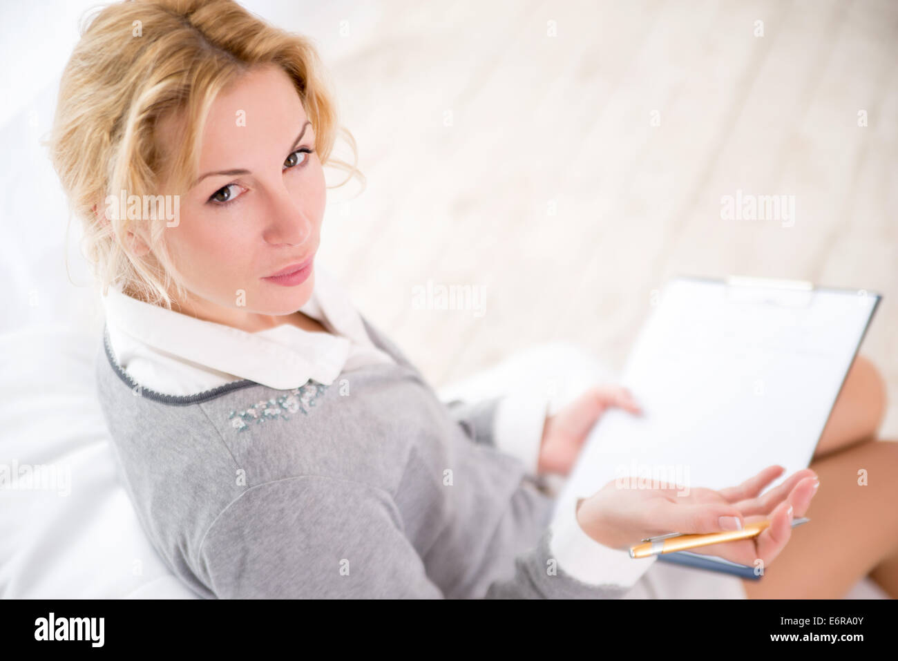 Professional psychiatrist looking at her patient during therapy session Stock Photo