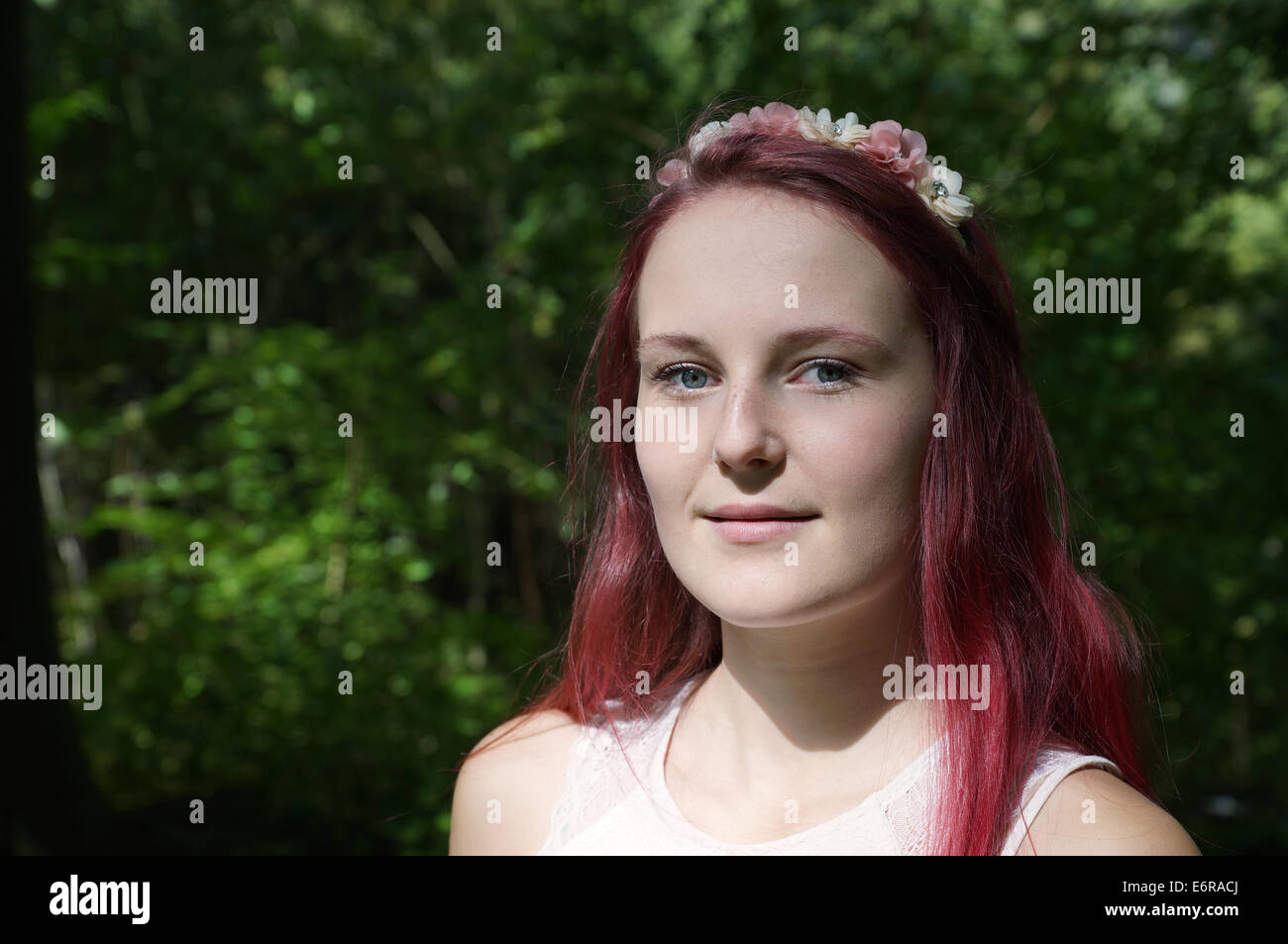 portrait of a young woman with flowers in her hair Stock Photo