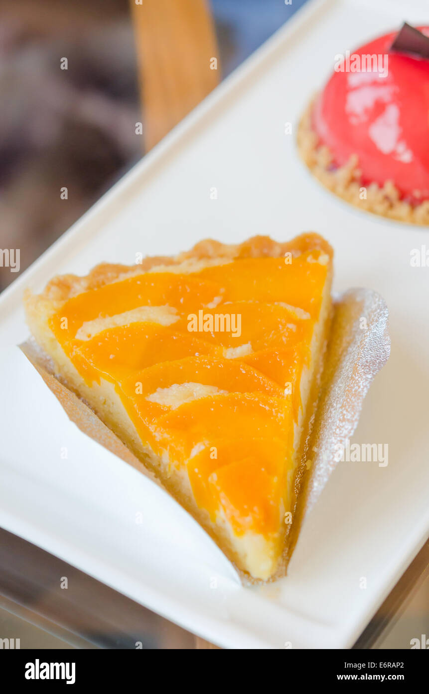 piece of peach tart on dish  , fruit dessert Stock Photo
