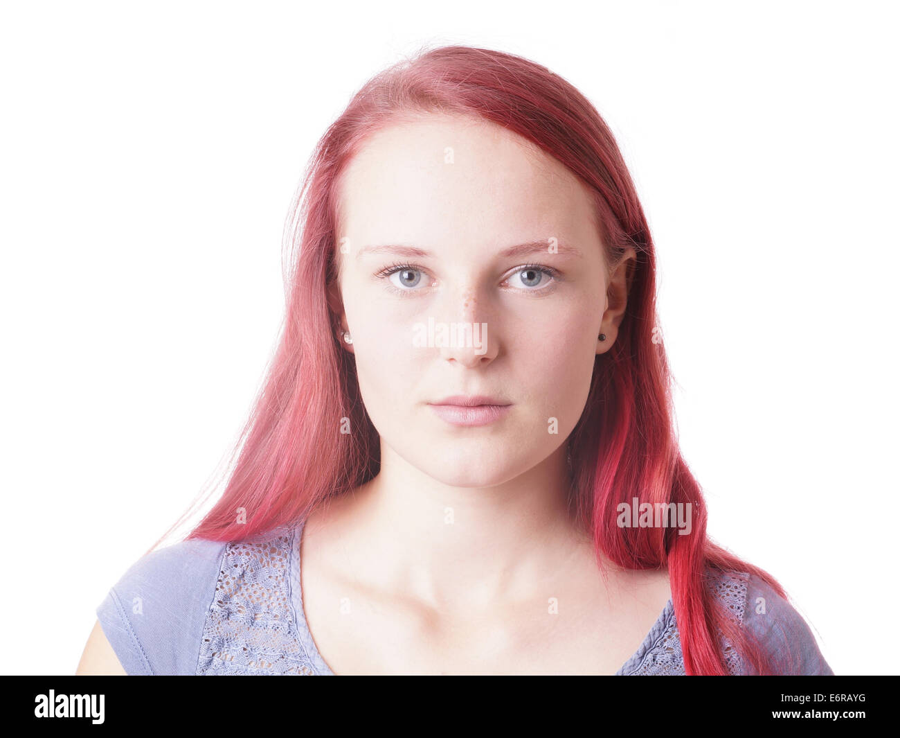 young woman with a neutral expression on her face Stock Photo
