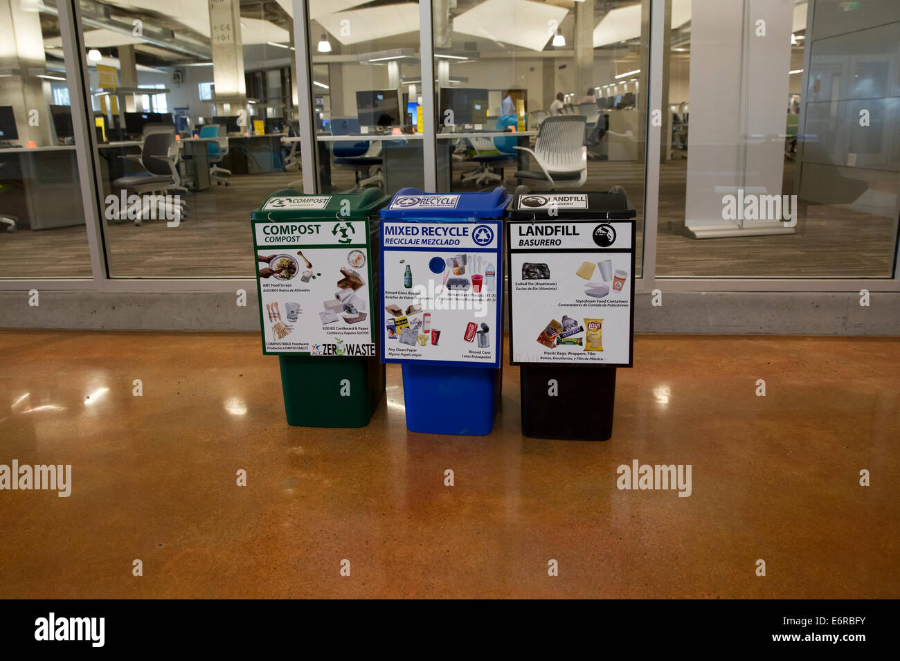 bilingual English and Spanish sign on recycling bins inside Austin