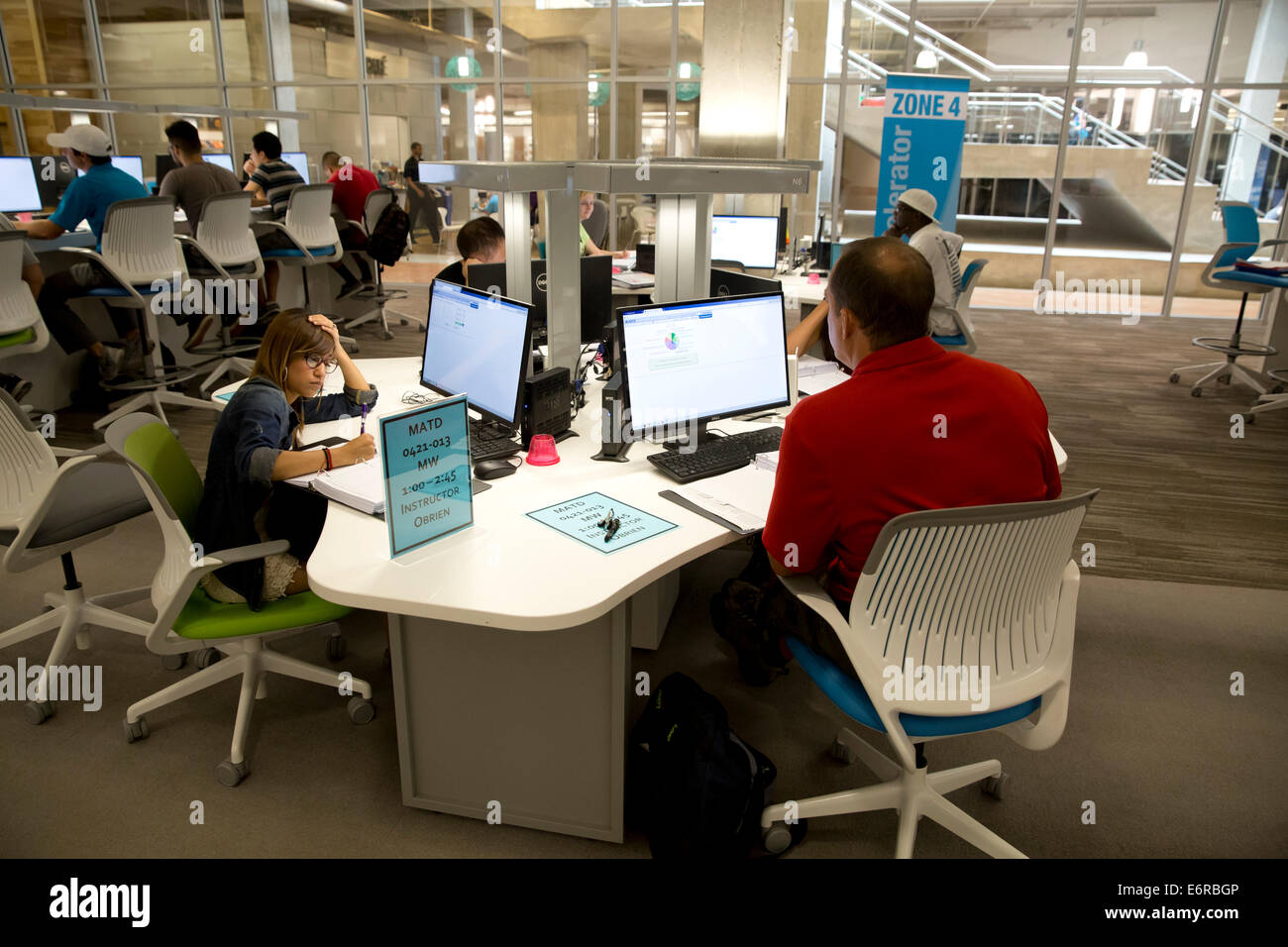 community college students use large computer lab to study, do research ...