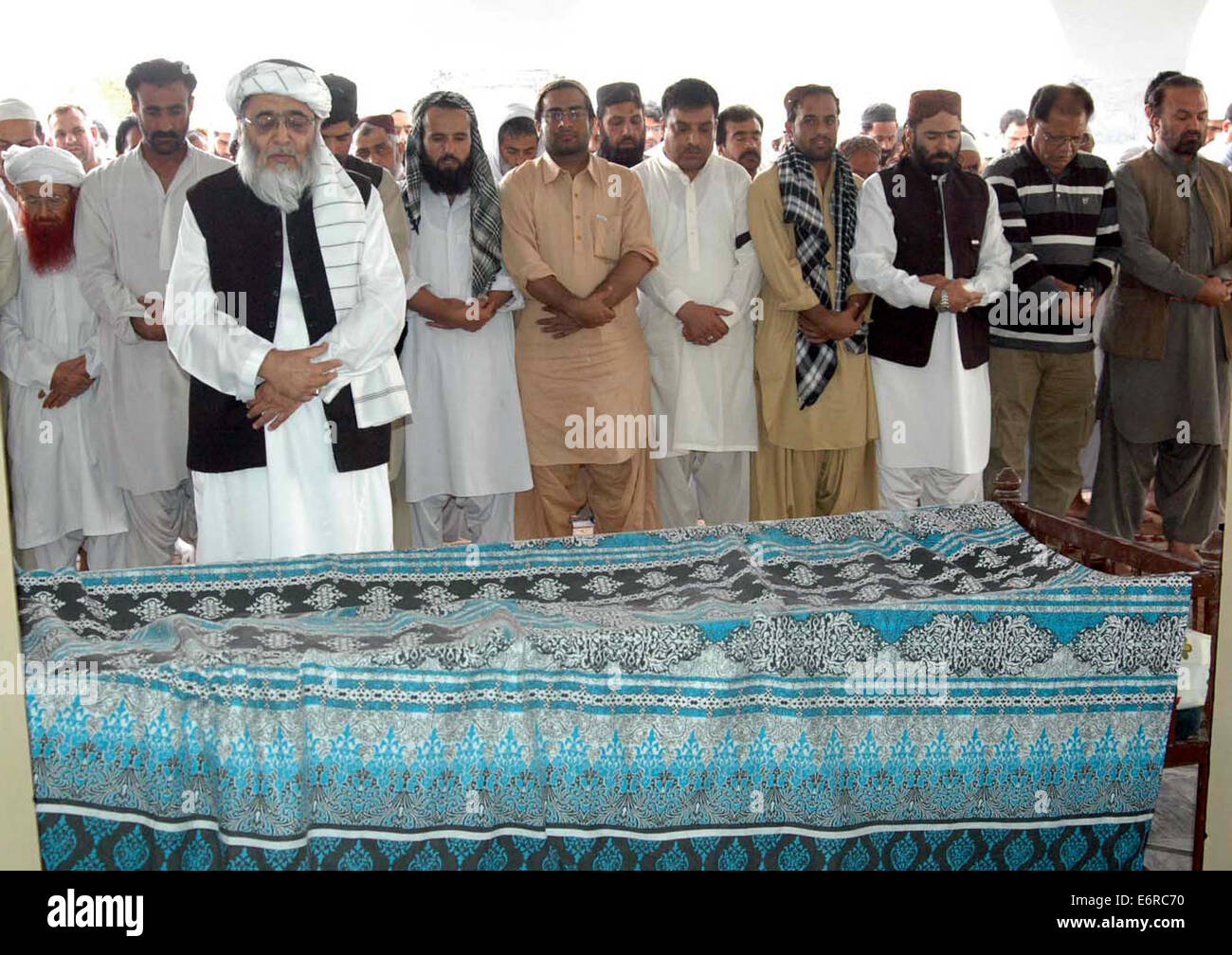 People offering funeral prayer of Muhammad Idrees, a journalist who assailant by unknown gunmen, at a mosque in Quetta on Friday, August 29, 2014. Stock Photo