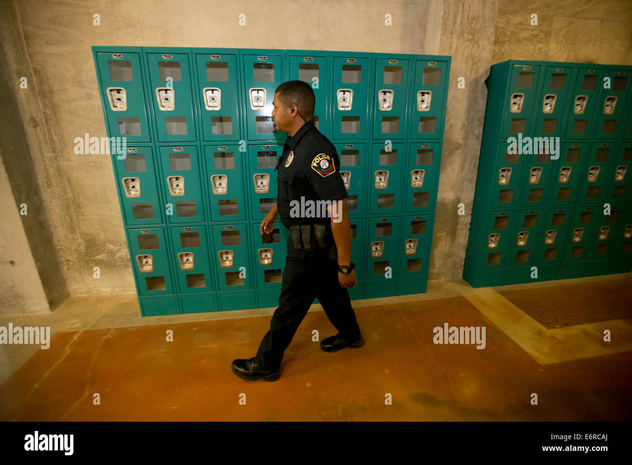 Austin Community College police officer patrols hallways, speaks to students at new campus building in Austin, Texas Stock Photo