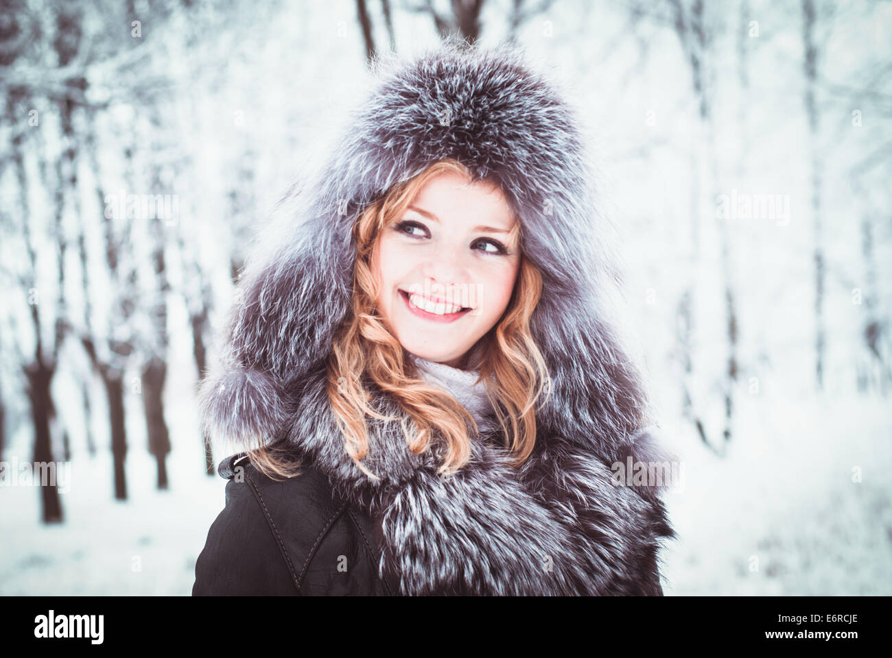 Woman is walking in park alley in winter Stock Photo - Alamy
