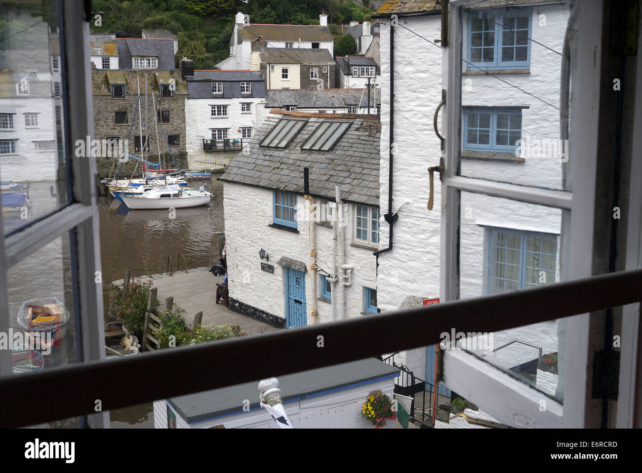 Polperro fishing village in Cornwall. View of harbour and cottages from