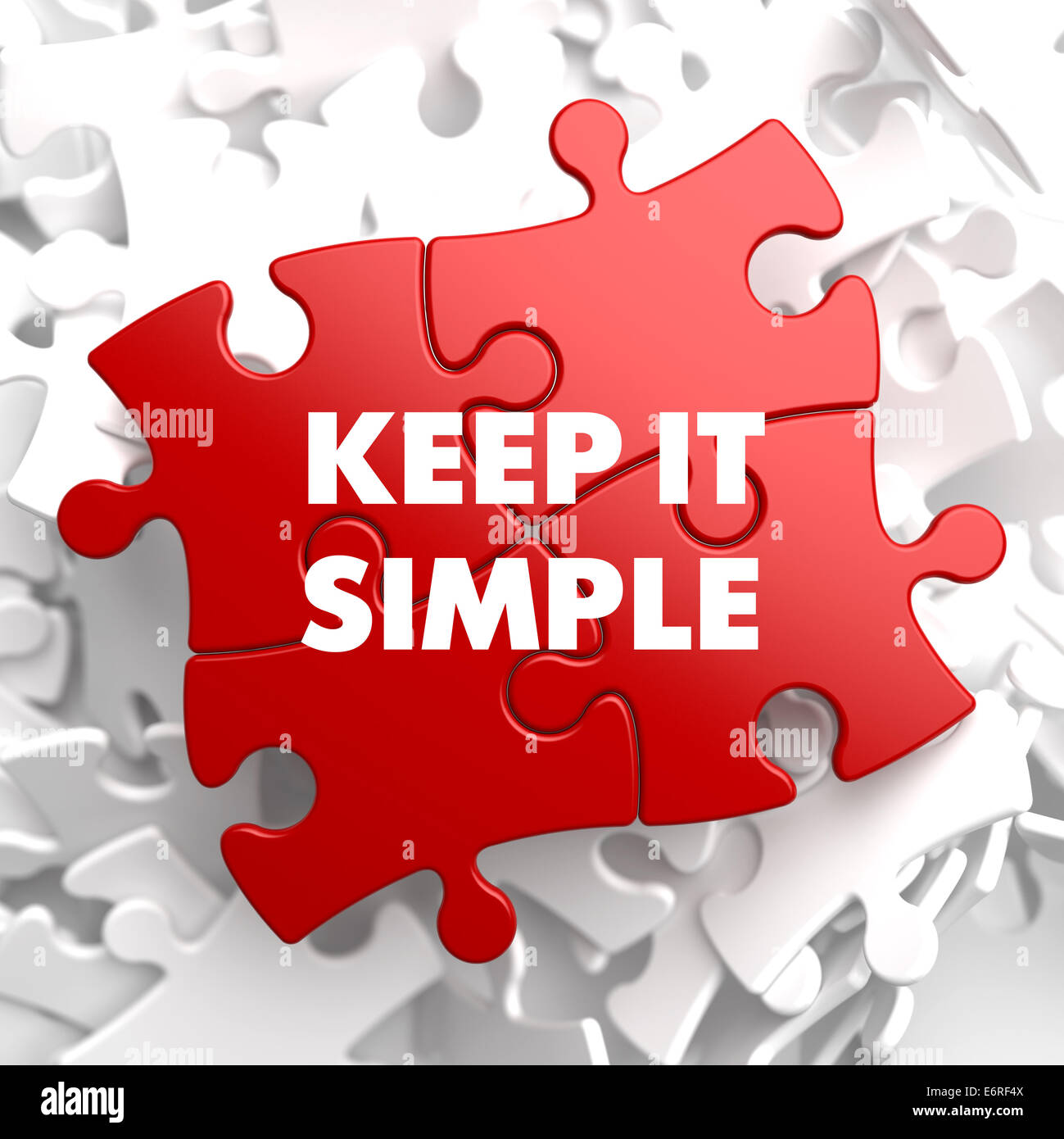 Keep it Simple on Red Puzzle. Stock Photo