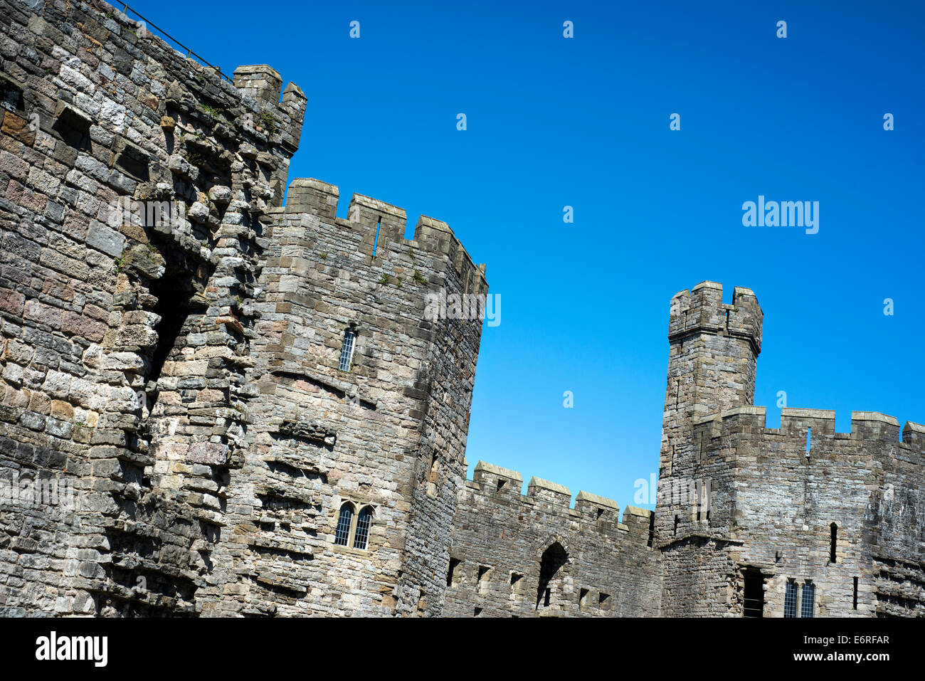 The walls of Caernarfon Castle in North Wales Stock Photo