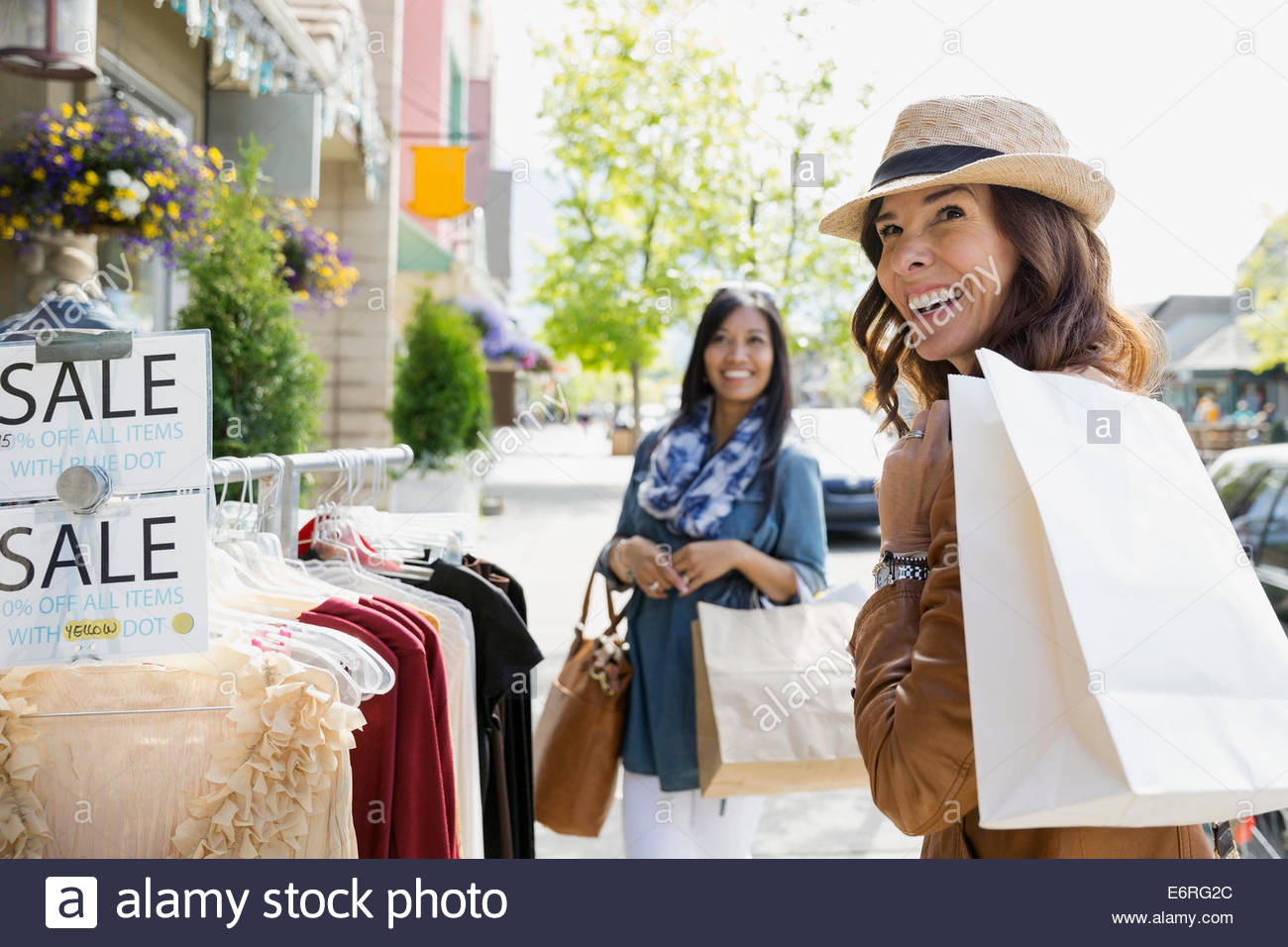 Women shopping on village street Stock Photo
