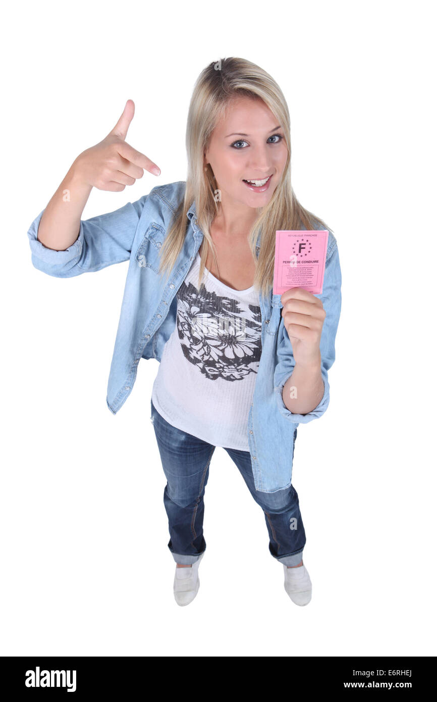 Blond teenager with driving license Stock Photo