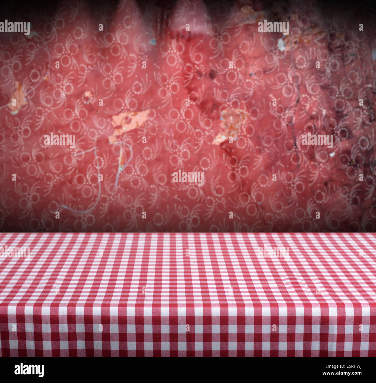 Vintage retro background with table and red wallpaper with ornament