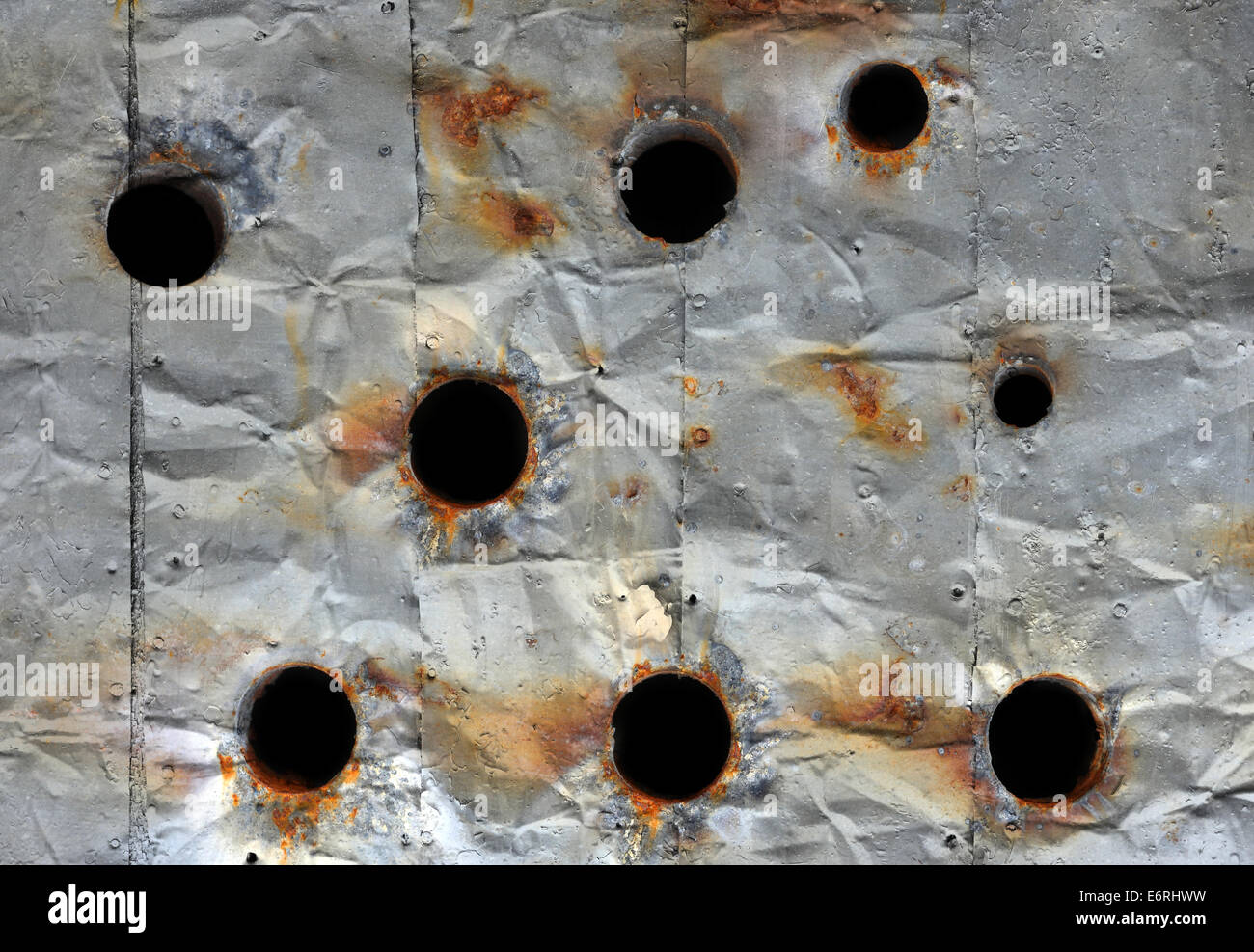 Old silver metal plate with bullet holes Stock Photo - Alamy