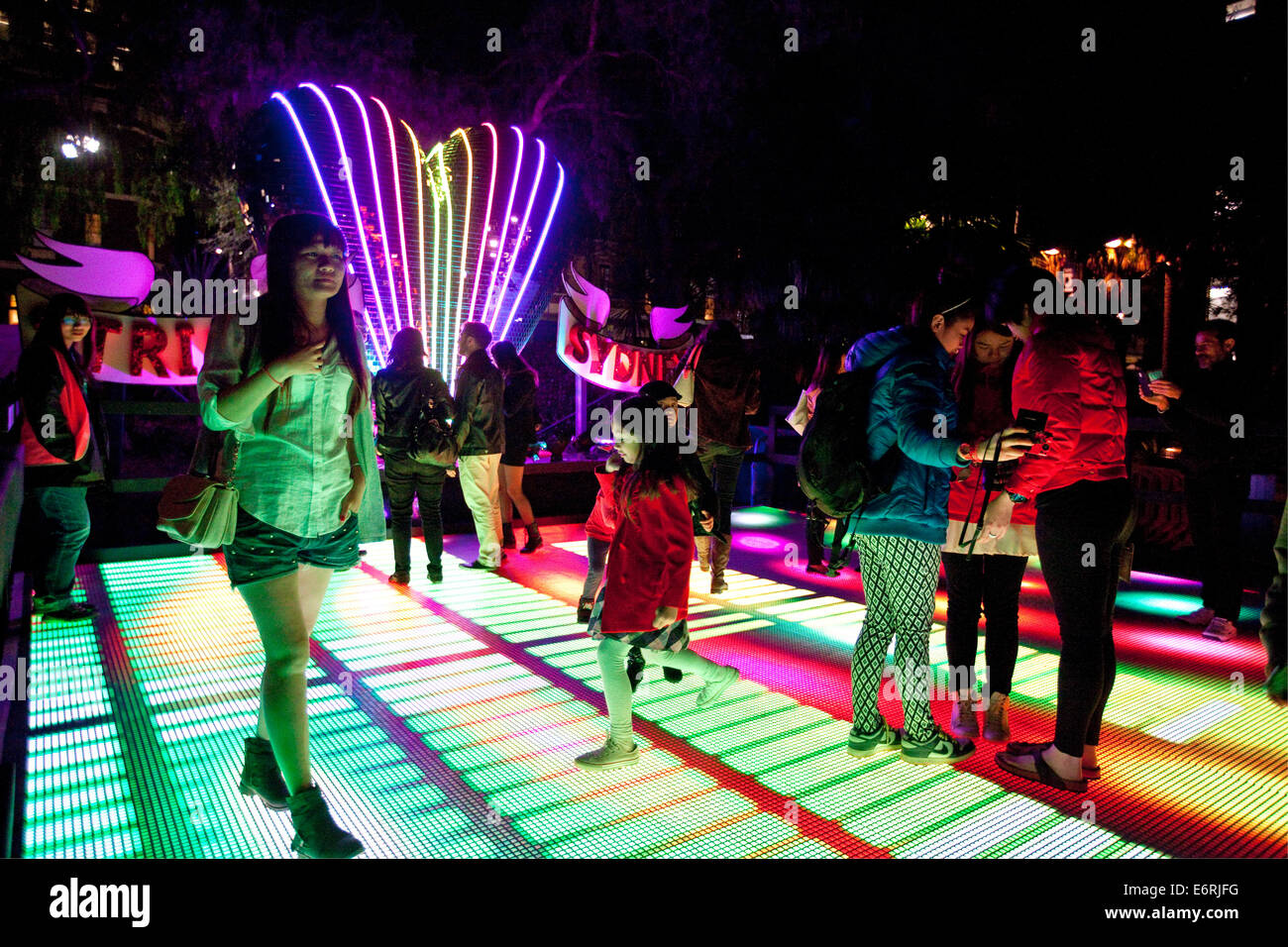 Tourists enjoy an interactive installation at the Vivid Festival, The Rocks, Sydney, NSW, Australia Stock Photo