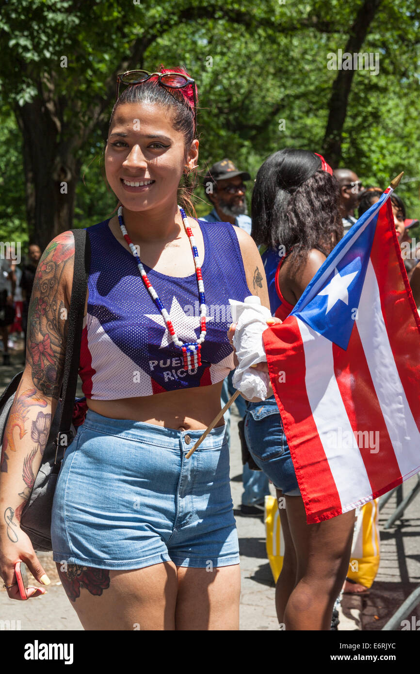 Young woman holding Puerto Rico flag, 8th June 2014 Puerto Rico Parade, Manhattan, New York City, New York, USA Stock Photo