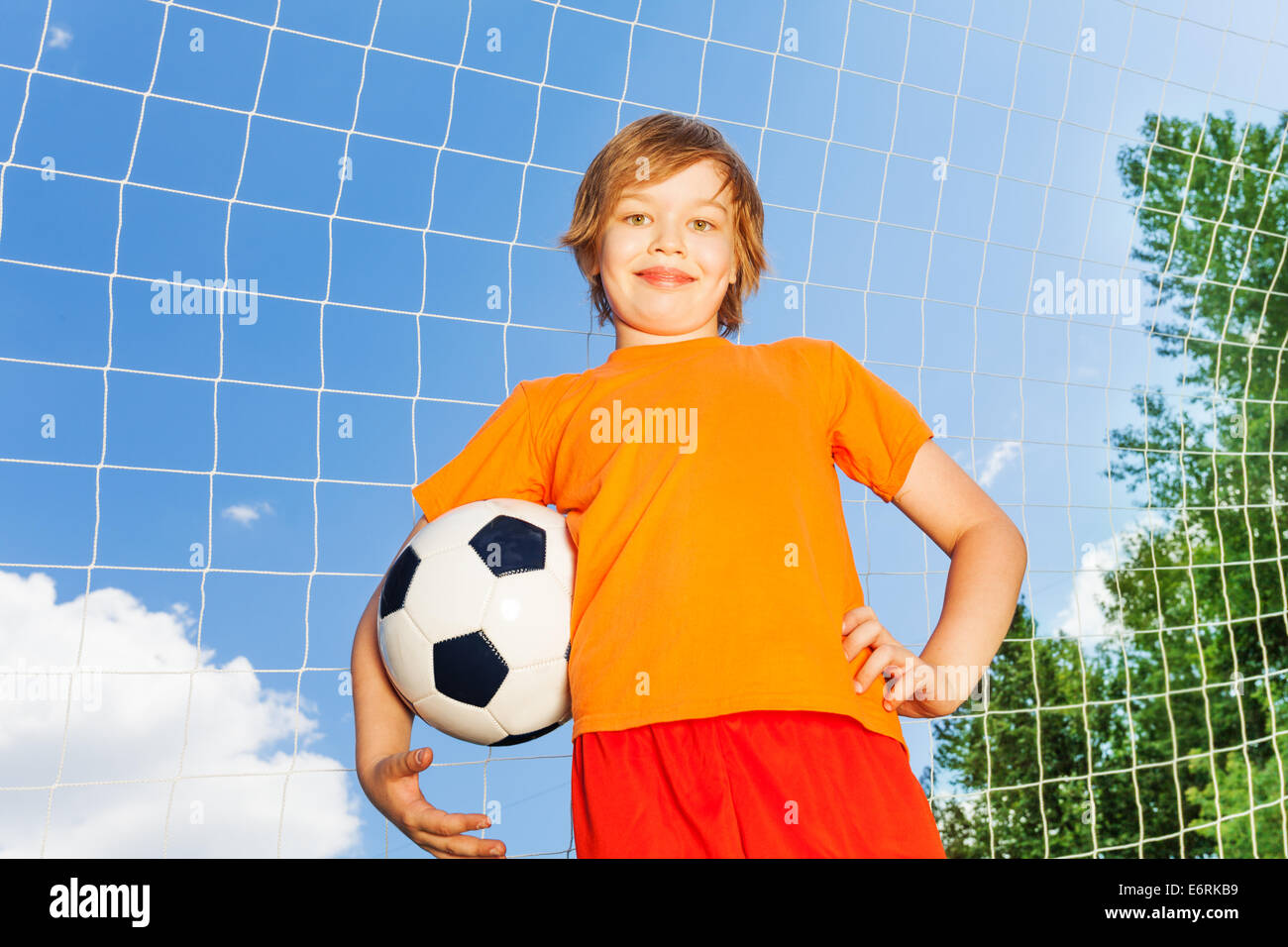 Child in orange shirt hi-res stock photography and images - Alamy