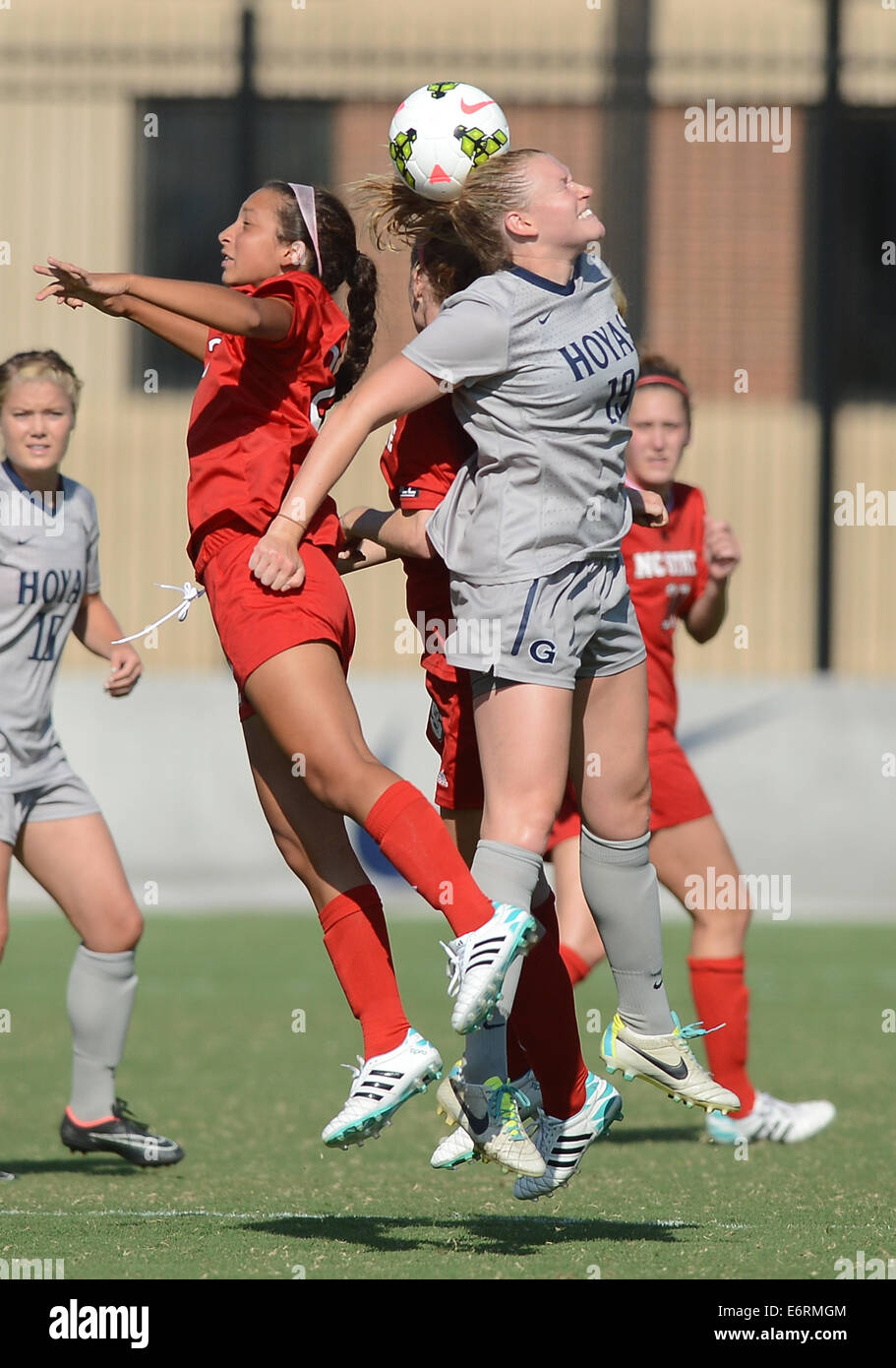 Washington, DC, USA. 29th Aug, 2014. 20140829 - Georgetown forward Ashley Shaffer (19) battles for a head ball with North Carolina State forward Caroline Gentry (25), left, and North Carolina State defender Cailyn Boch (22), back, in the second half at Shaw Field in Washington. Georgetown defeated N.C. State, 6-0. © Chuck Myers/ZUMA Wire/Alamy Live News Stock Photo