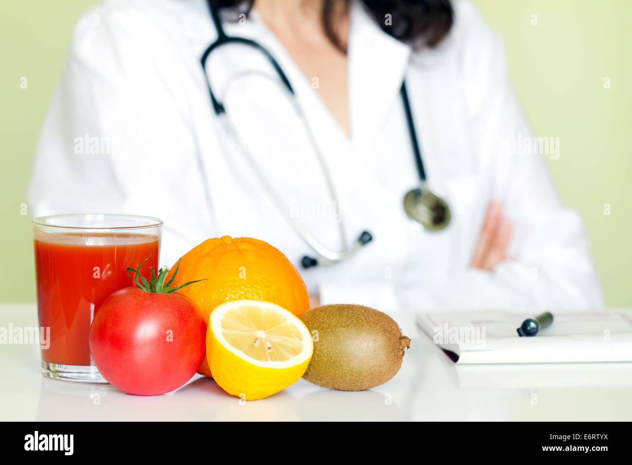 Doctor nutritionist in office with healthy fruits diet concept Stock Photo