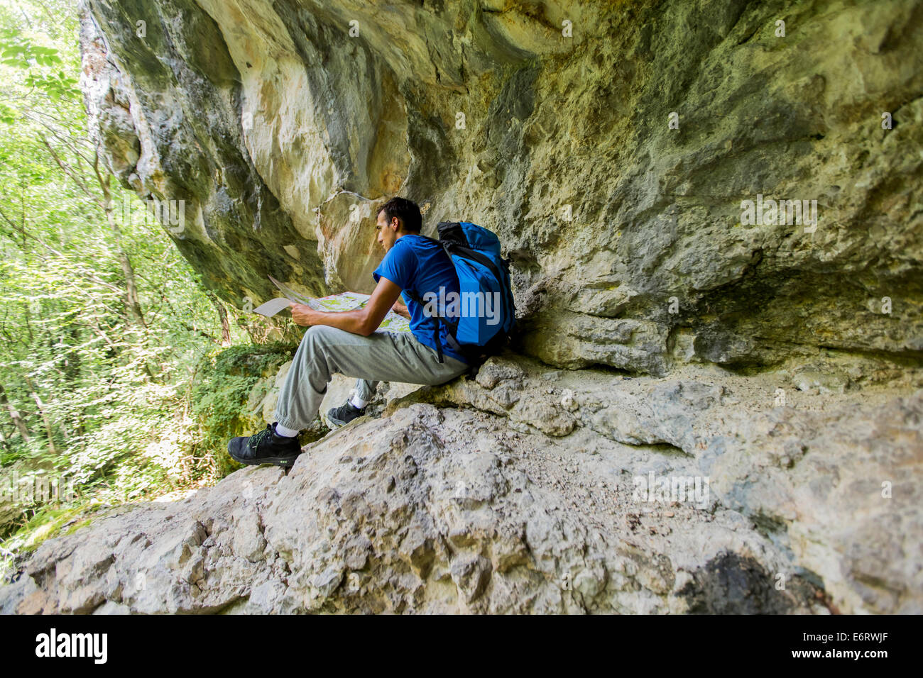 Young man hiking Stock Photo - Alamy