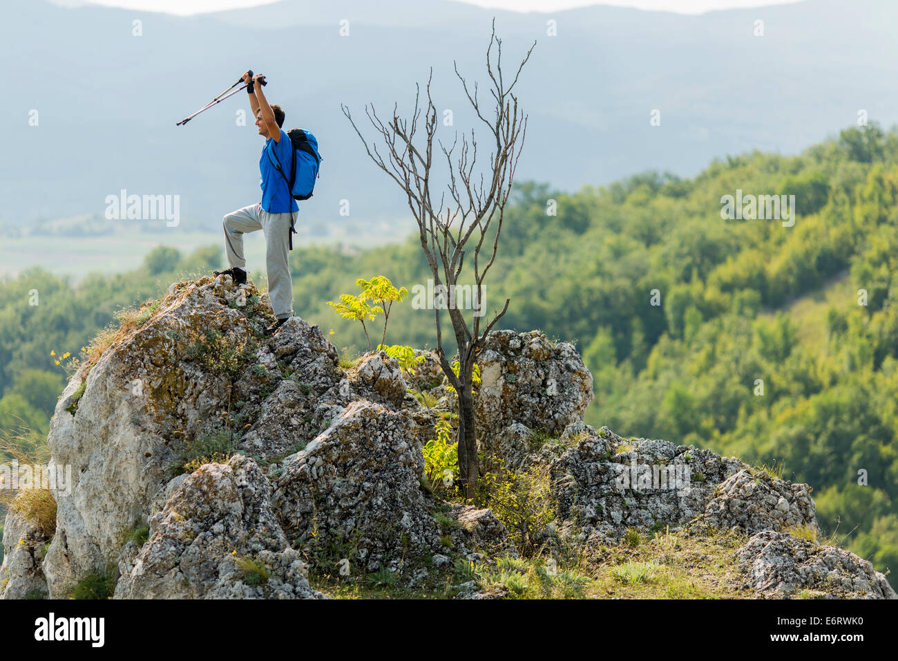 Young man hiking on the mountain Stock Photo - Alamy