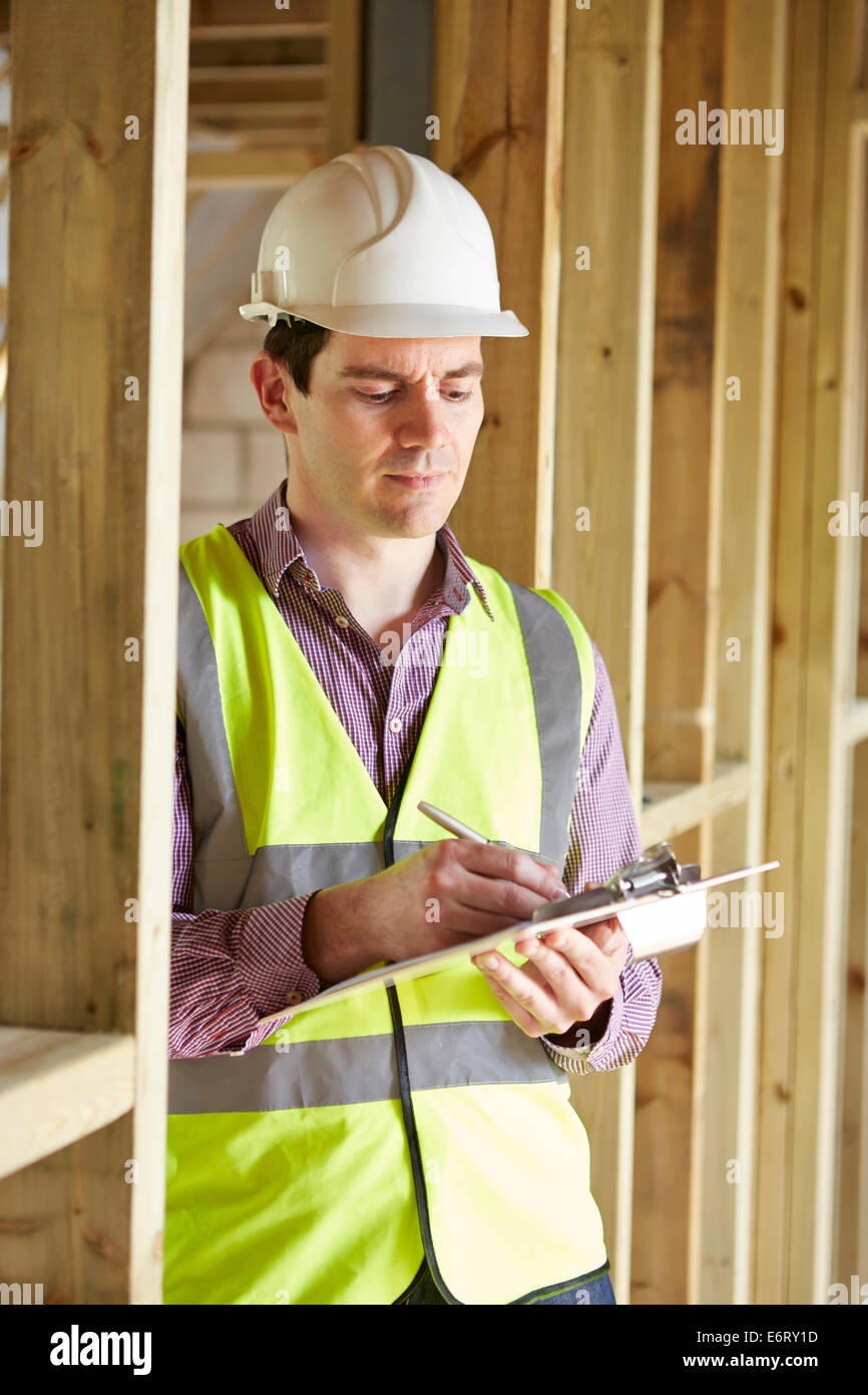 Building Inspector Looking At New Property Stock Photo