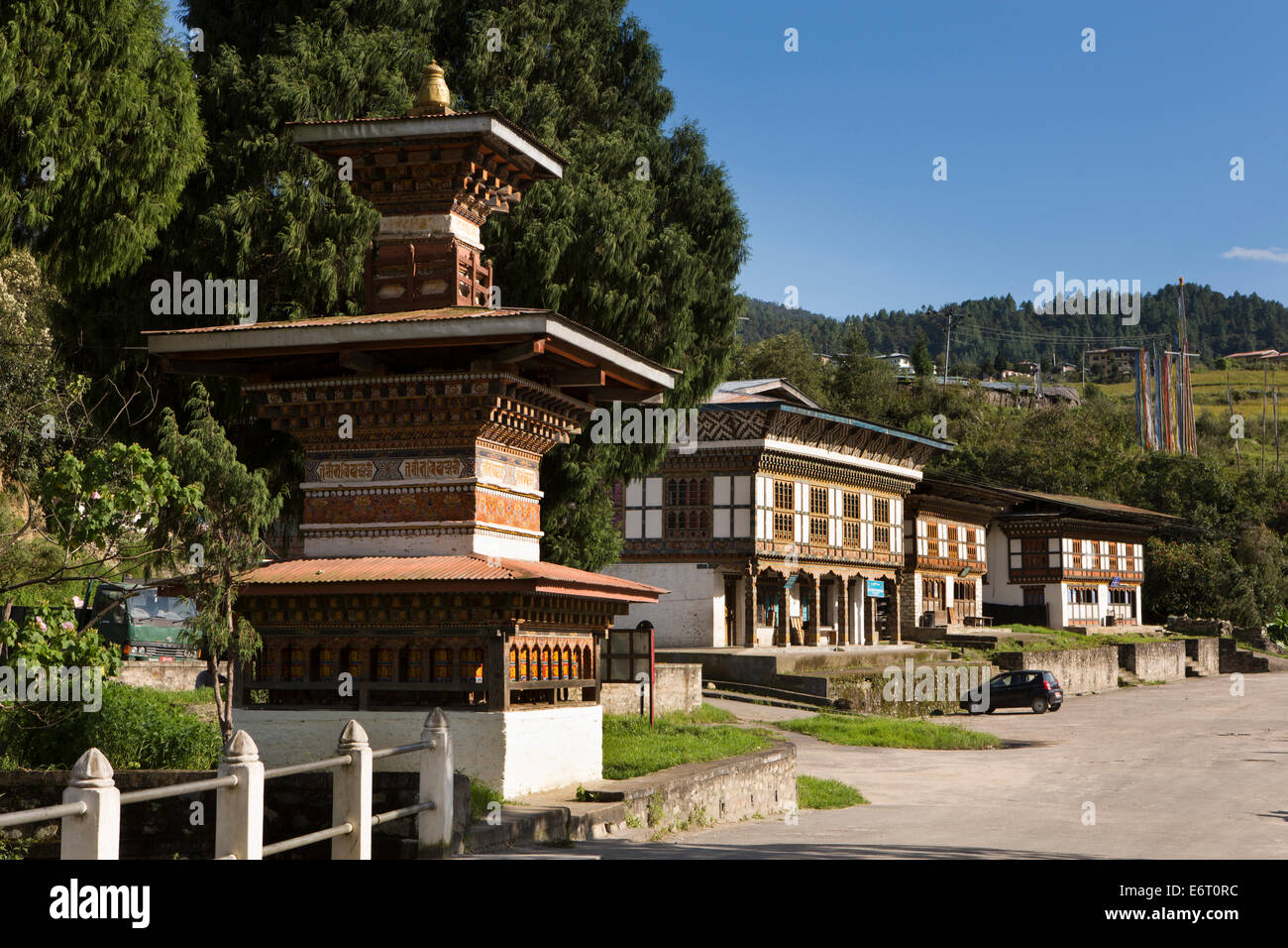 Eastern Bhutan, Trashi Yangtse, bazaar, Buddhist roadside chorten and shops Stock Photo