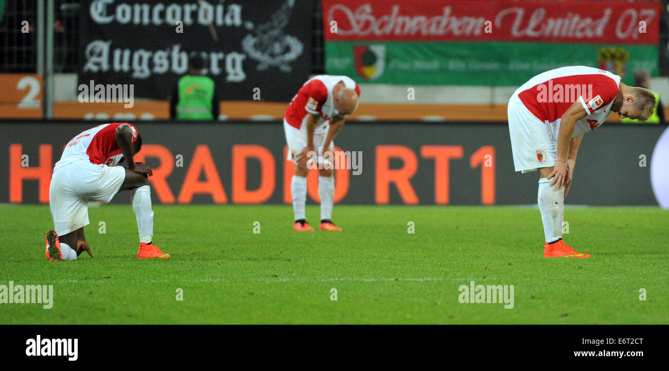 Augsburg, Germany. 29th Aug, 2014. Augsburg'S players Abdul Baba (L-R), Tobias Werner and Jan-Ingwer Callsen-Bracker during the Bundesliga soccer match between FC Augsburg and Borussia Dortmund at SGL-Arena in Augsburg, Germany, 29 August 2014. August lost the match 2-3. Photo: Stefan Puchner/dpa/Alamy Live News Stock Photo