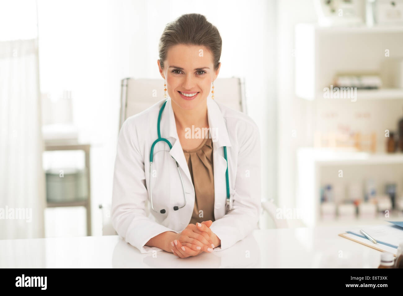 Portrait of smiling doctor woman in office Stock Photo