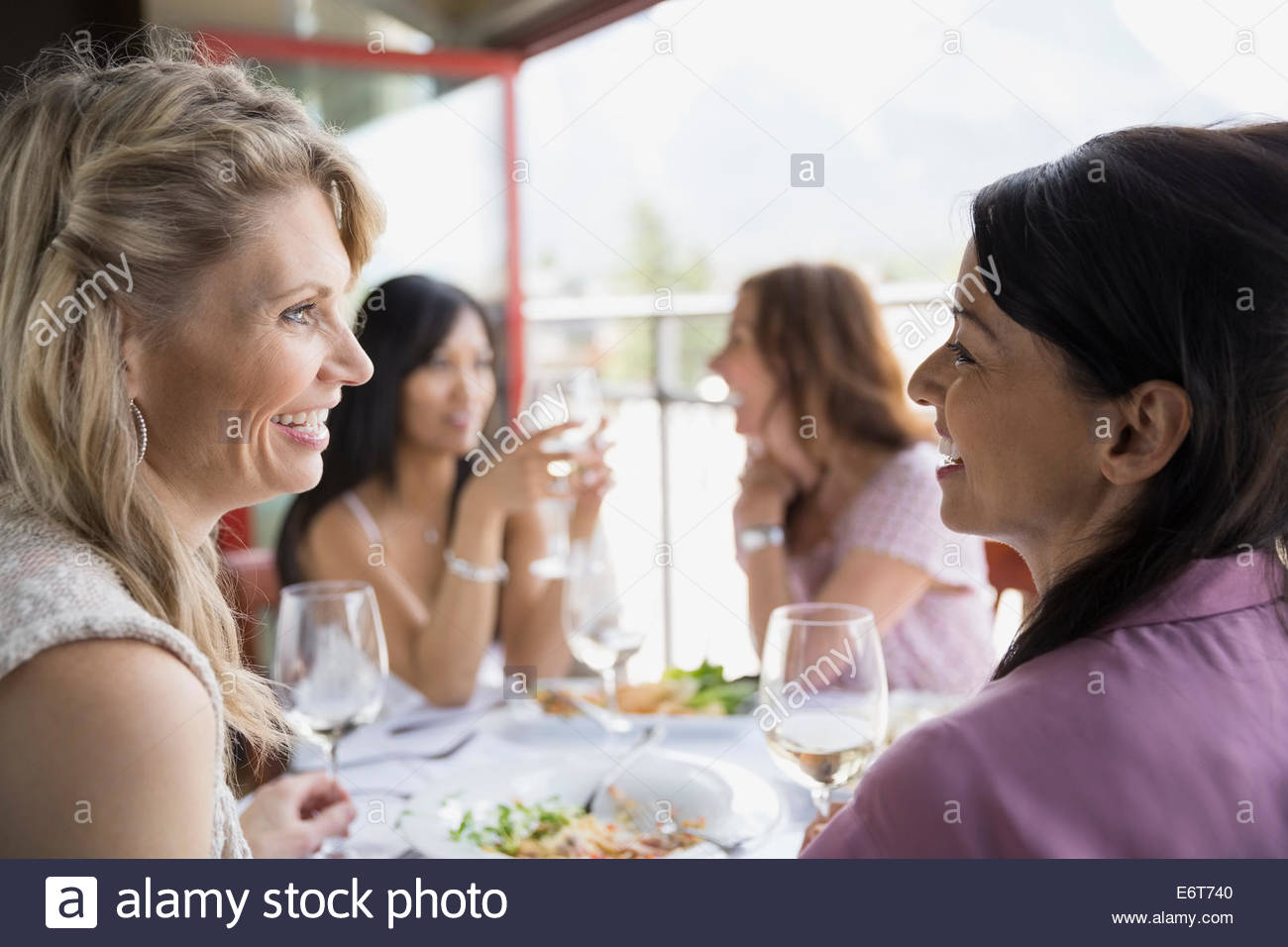 Women eating together in restaurant Stock Photo