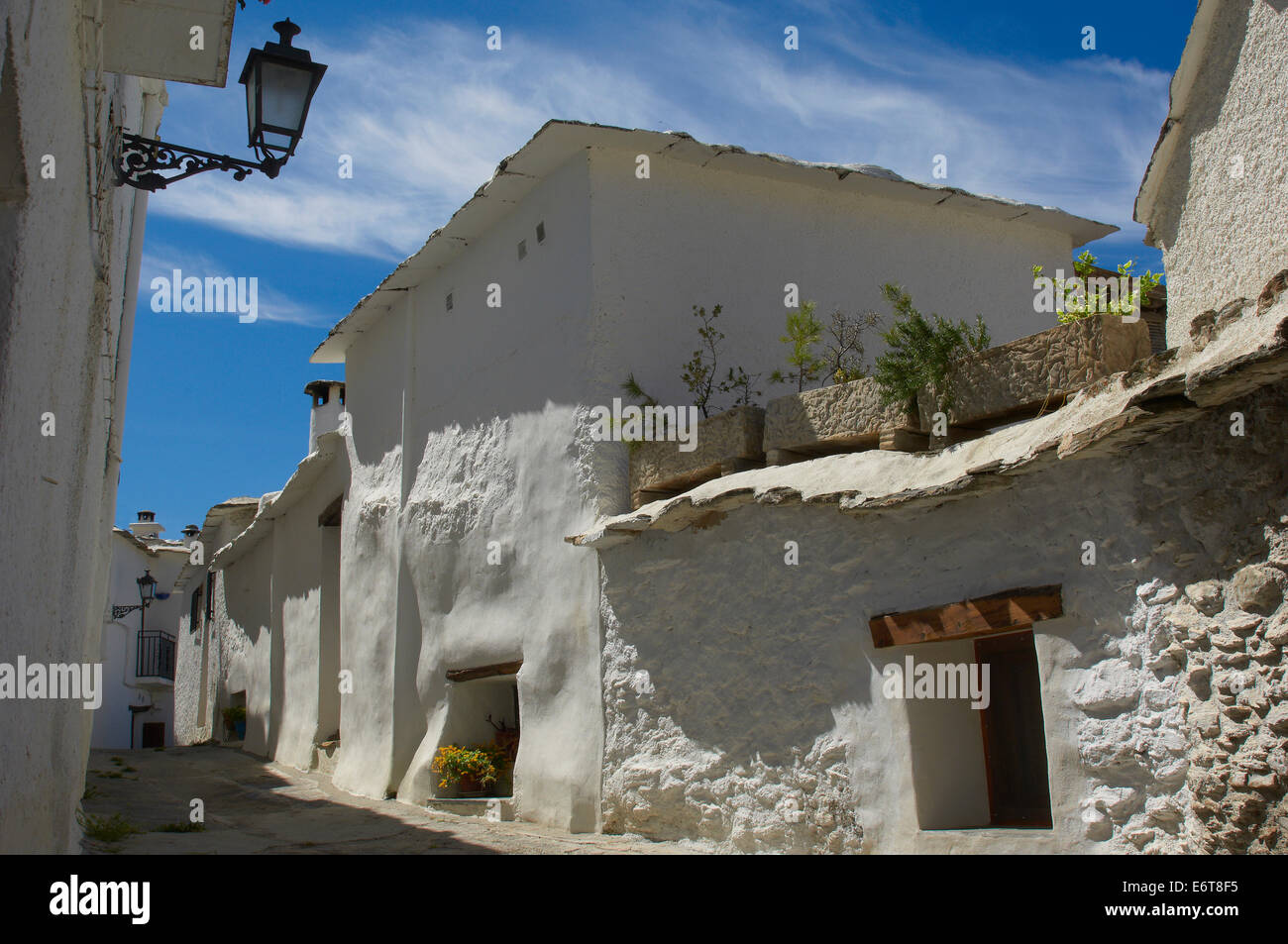 Laundry drying in Capileira, Spain, a white village. Capileira is the  highest and most northerly of three villages nearby Stock Photo - Alamy