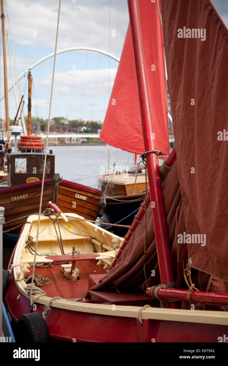 Old sailing boats gathered for a festival at the quayside on the River Tyne in Newcastle. Stock Photo
